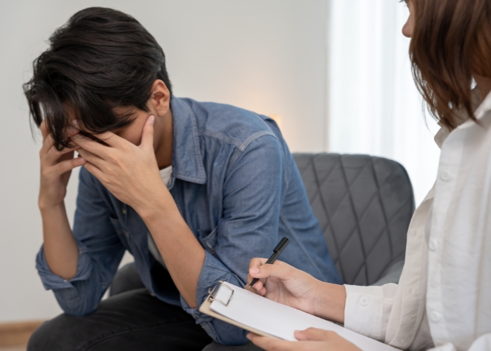 Happy woman holding purple flowers